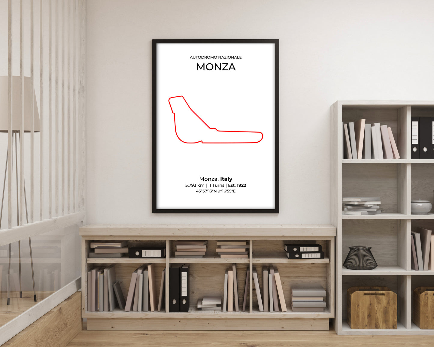 Framed poster of a red racing line drawing on a wall above a bookshelf.