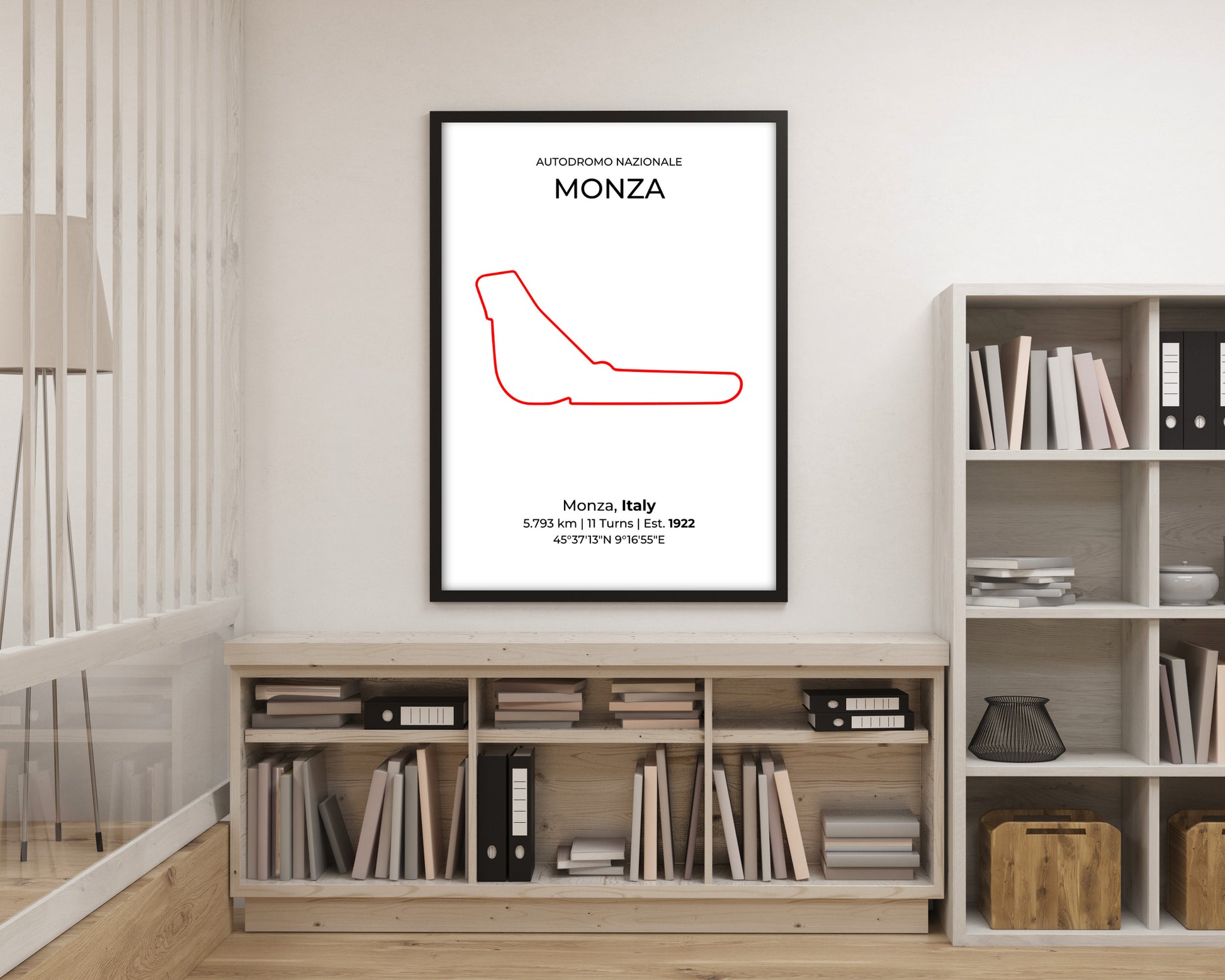 Framed poster of a red racing line drawing on a wall above a bookshelf.