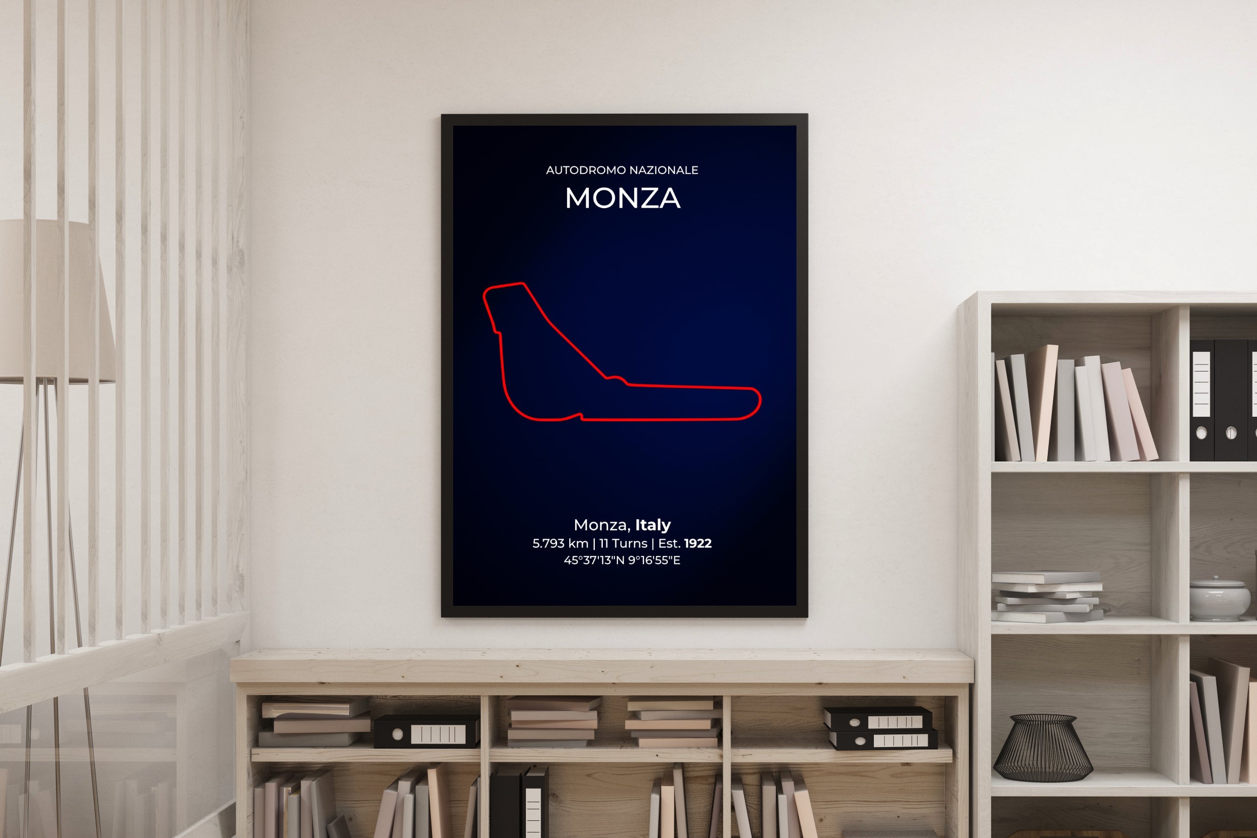 Poster of a race track layout on a wall above a bookshelf.